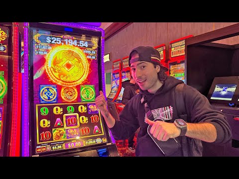Man smiling beside glowing casino slot machine